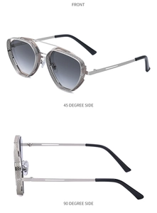 Detail view of retro steampunk sunglasses with silver hollow frame and gray lenses