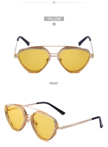 Detail of steampunk sunglasses featuring golden metal frames and yellow mesh side shields
