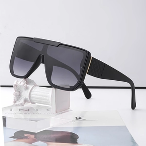 Women's oversized flat top sunglasses with black frame and quilted texture temples