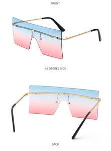 Détail de lunettes de soleil carrées sans monture avec verres dégradés bleu et rose
