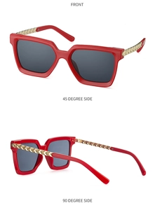 Three-angle view of fashion square sunglasses featuring red frames and gold metal chain temples