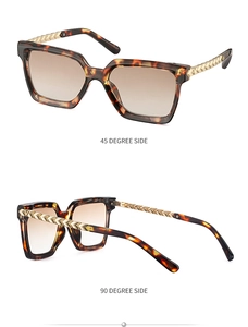 Detail view of tortoiseshell sunglasses featuring golden woven texture and V-shaped metal legs