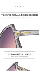 Detail von goldenem T-Metallscharnier und lila Verlaufsgläsern an grauer Sonnenbrille