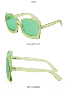 Detailansicht der transparent grünen Oversize-Sonnenbrille mit goldenen T-Metallscharnieren