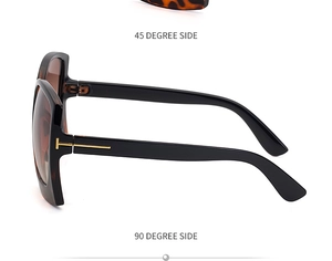 Detailansicht der großen Sonnenbrille mit goldenem T-Scharnier und Schildpatt-Muster