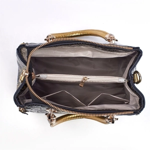 Top view of tote bag interior featuring central zipper pocket and grey chevron lining