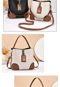 Détail de sacs seaux tendance en noir et beige avec cuir texturé et pendentifs métalliques
