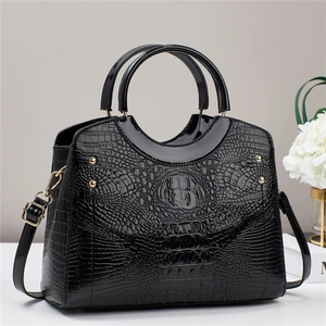 Elegant black crocodile pattern tote bag with gold hardware and top handle strap
