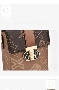 Detail of vintage brown leather bag featuring textured print and golden metal buckle