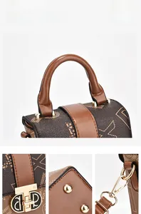 Detailed views of vintage crossbody bag with gold D-buckle and monogram print texture