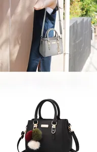Detail of lychee pattern leather bags with pom-pom and tassel charms in gray and black
