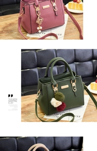 Detail of lychee pattern leather bags in green and magenta with golden hardware