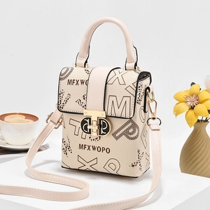 Chic beige crossbody bag with artistic letter prints and gold metallic buckle closure