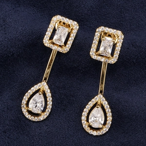 Elegant gold drop earrings with square and teardrop zircon crystals on a dark blue base