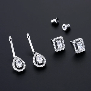 Exquisite square and pear-shaped zircon earrings set in silver finish on black background