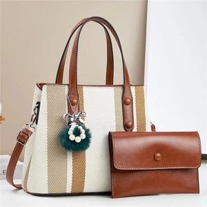 Chic beige and brown striped tote bag set with pom-pom charm and matching clutch