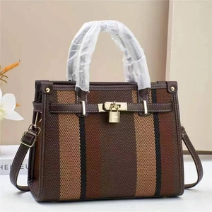 Fashionable striped crossbody bag with gold padlock and adjustable shoulder strap