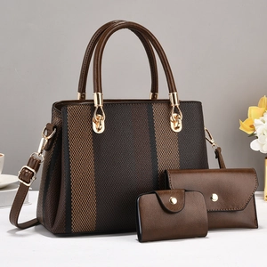 Three-piece brown tote bag set with textured vertical stripes and elegant gold hardware