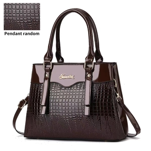 Dark brown faux leather handbag with crocodile pattern texture and gold Jematox logo
