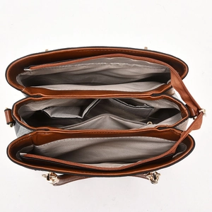 Internal view of spacious handbag with three compartments and grey herringbone lining