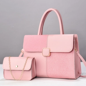 Detailed view of pink tote and matching chain bag set with elegant gold buckles