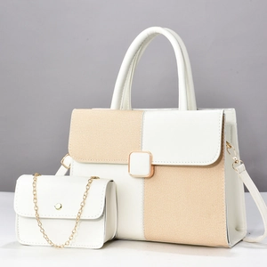 Close-up of contrast faux leather and textured fabric two-piece set handbag combo