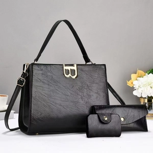 Chic black 3-piece handbag set featuring large tote with gold B buckle and textured faux leather