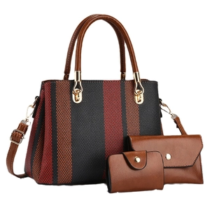 Three-piece set of striped canvas tote, brown leather clutch, and mini wallet