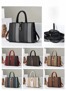 Detail view of large PU leather striped tote handbag with dimensions L33*W12*H25cm