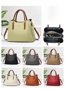 Detail view of large capacity PU leather handbag with multi-compartment interior layout