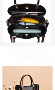Detail view of large capacity crossbody bag with multiple interior compartments and magnetic closure