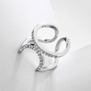 Crossed silver geometric nail ring with sparkling pavé rhinestones in adjustable design