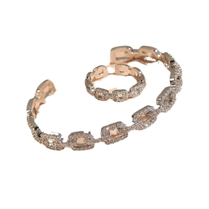 Rose gold hollow geometric jewelry set with sparkling zircons featuring bangle and ring