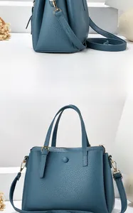 Detailed side and front view of blue lychee texture leather handbag with shoulder strap