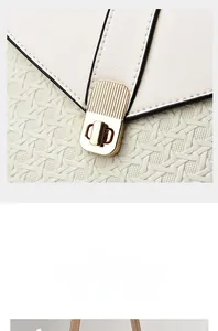 Close-up of elephant grey bucket bag with pale gold twist lock and woven texture