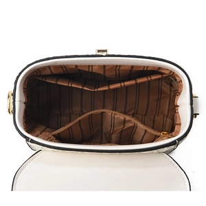 Interior view of bucket bag showing striped lining, zipper pocket, and inner compartments