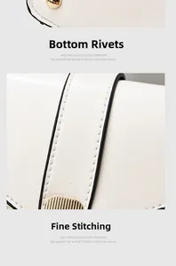 Close-up of bottom rivets and delicate stitching on a cream bucket bag detail