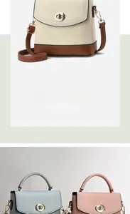 Detail of lychee pattern PU leather bucket bag with metal rotary lock and stitching