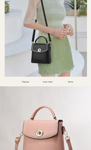 Detail of crossbody bucket bag with litchi texture leather and gold rotary lock buckle