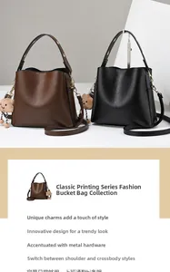 Detail of hardware accents and bear charm on brown and black leather bucket bags