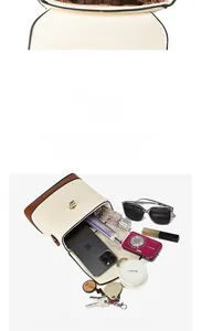 Detail view of the contrast leather bucket bag interior and organized compartments