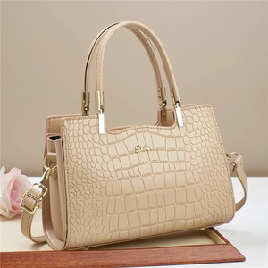 Elegant beige stone pattern tote bag with gold metal hardware and adjustable strap