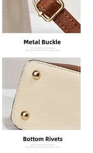 Detail of the bucket bag showing golden hardware buckle and anti-wear bottom rivets