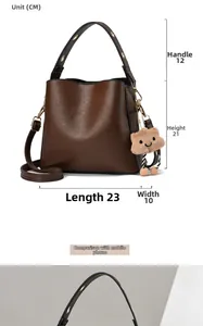 Detailed dimension guide for brown leather bucket bag showing 23x10x21cm size and strap