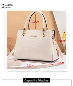 Detailed view of beige crocodile pattern handbag showing size dimensions of 28x21x13cm