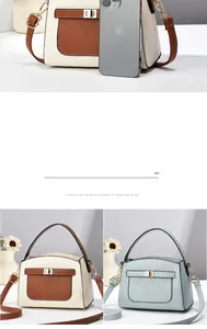 Détail de la texture cuir grainé et boucle métallique du sac à bandoulière