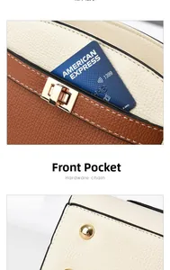 Détail du sac en cuir avec poche avant pour cartes et pieds de protection en métal