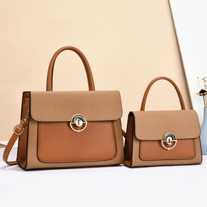 Two-piece set of caramel and beige woven tote bags with elegant gold buckle detail