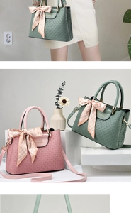 Detail of crocodile pattern handbags in pink and green with silk scarf decorations