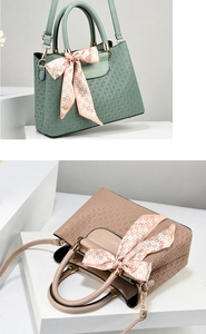 Detail of woven texture handbags in green and pink with decorative checkered silk bows